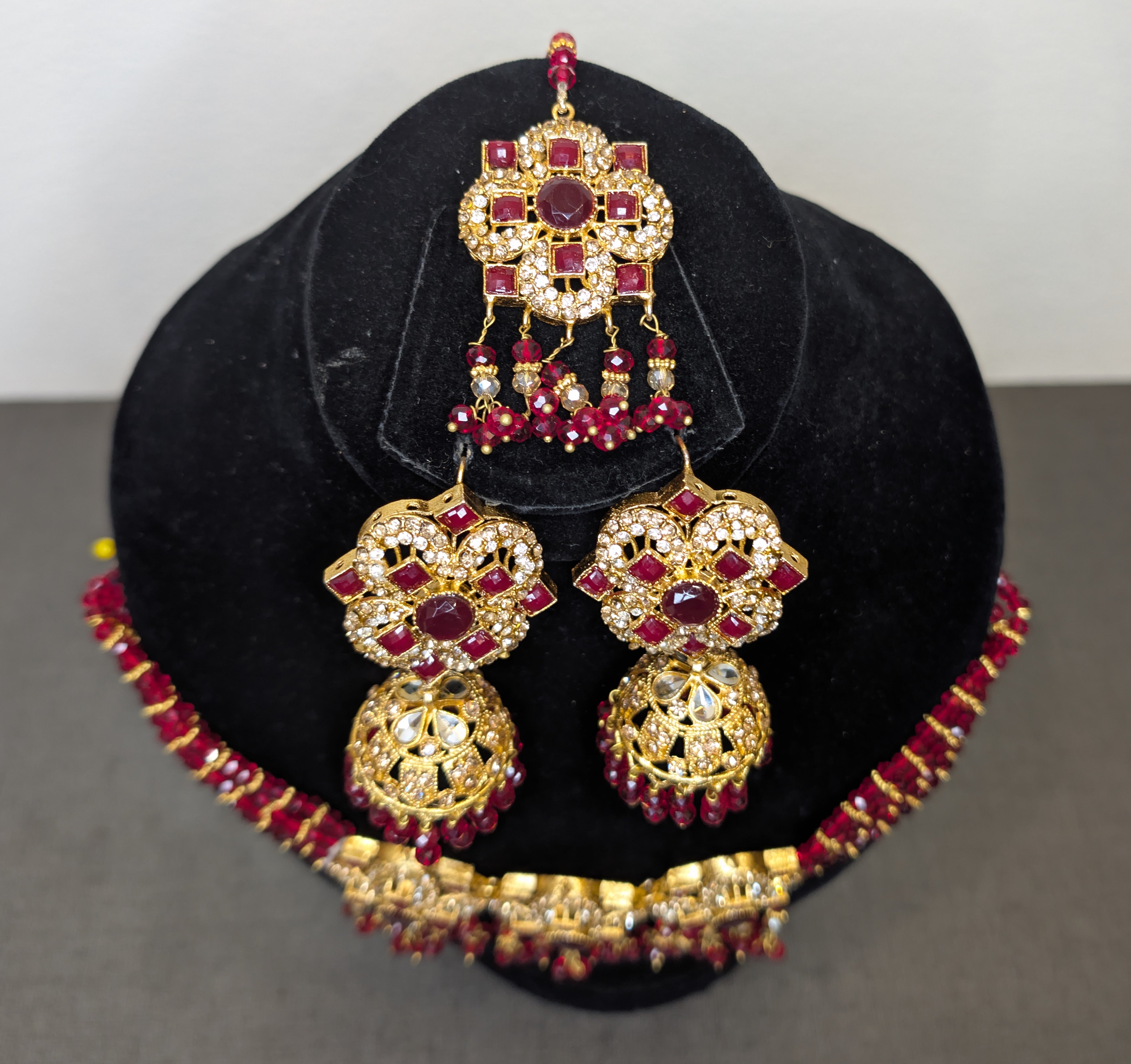 ear ring and head set in red stone