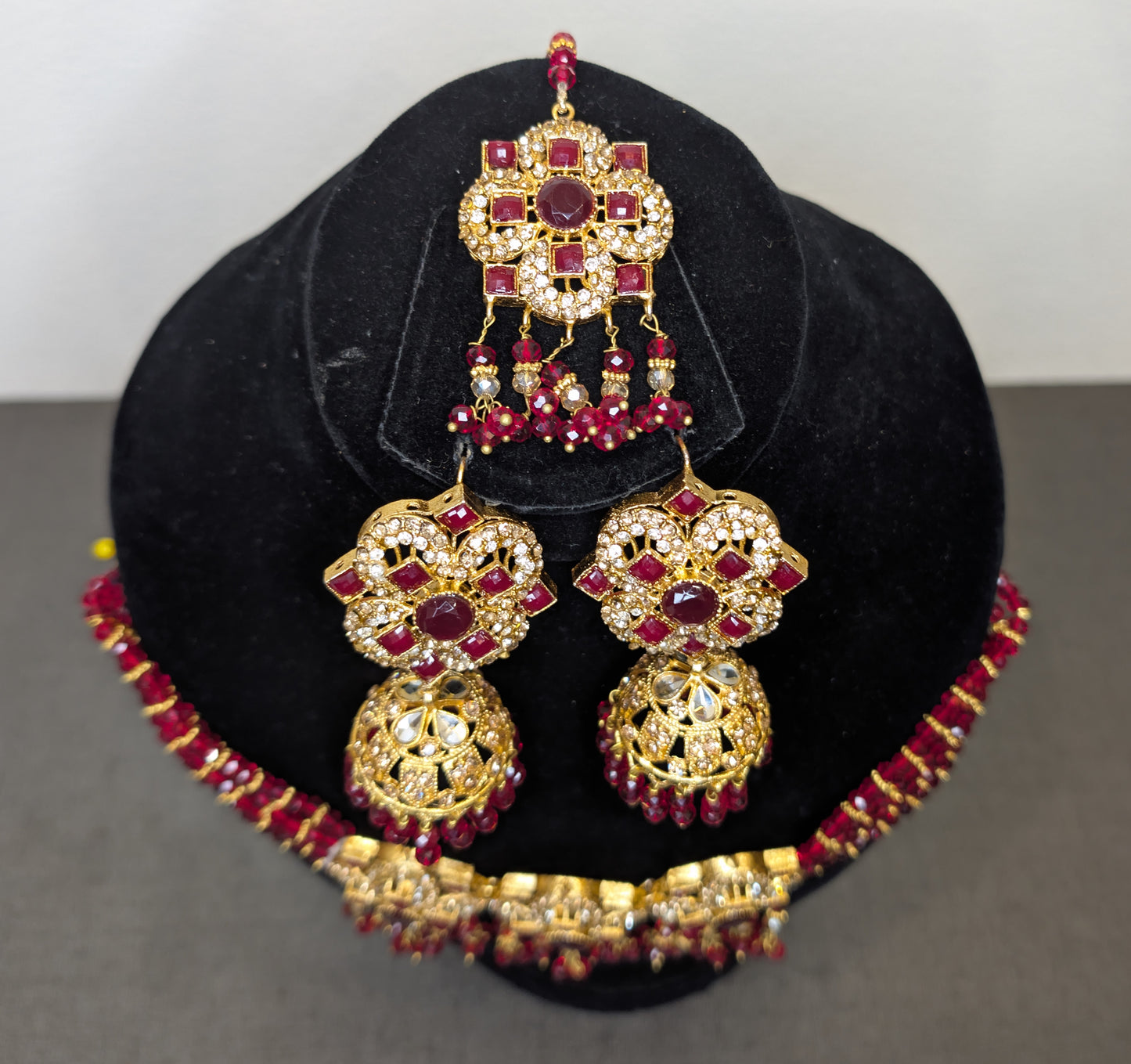 ear ring and head set in red stone